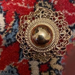 Crown Trifari gold tone brooch with flower filigree